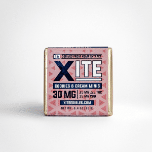 A pink-wrapped Xite D9 Cookies & Cream Mini edible with 30mg (15mg Delta-9 THC, 15mg CBD) from hemp extract. Net wt. 0.4 oz (12g).