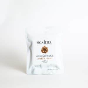 A white resealable bag labeled "SESHNZ Campfire Smores Mushroom Chocolate Half Bar" is displayed against a plain white background.