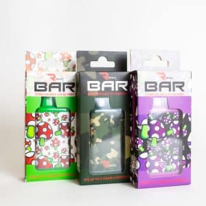 Three boxed Rokin Bar - Concealable 510 Batteries are shown upright, featuring different designs: one with mushrooms, one camouflage, and one with a purple and white pattern.