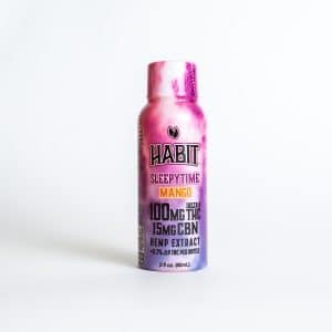 A 2 fl oz bottle of HABIT Mango Dream Shot - 10mg, featuring hemp extract on a white background.