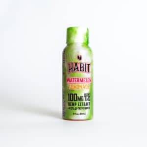 A green bottle labeled "HABIT Watermelon Lemonade Shot - 10mg" (2 fl oz/60mL) stands against a plain white background.