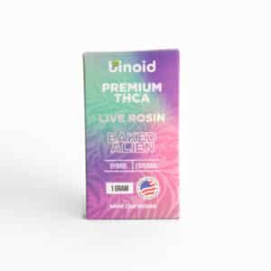 A box labeled “Binoid THCa Vape Cart - Baked Alien HYBRID - 1g” features a hybrid vape cartridge and an American flag emblem.